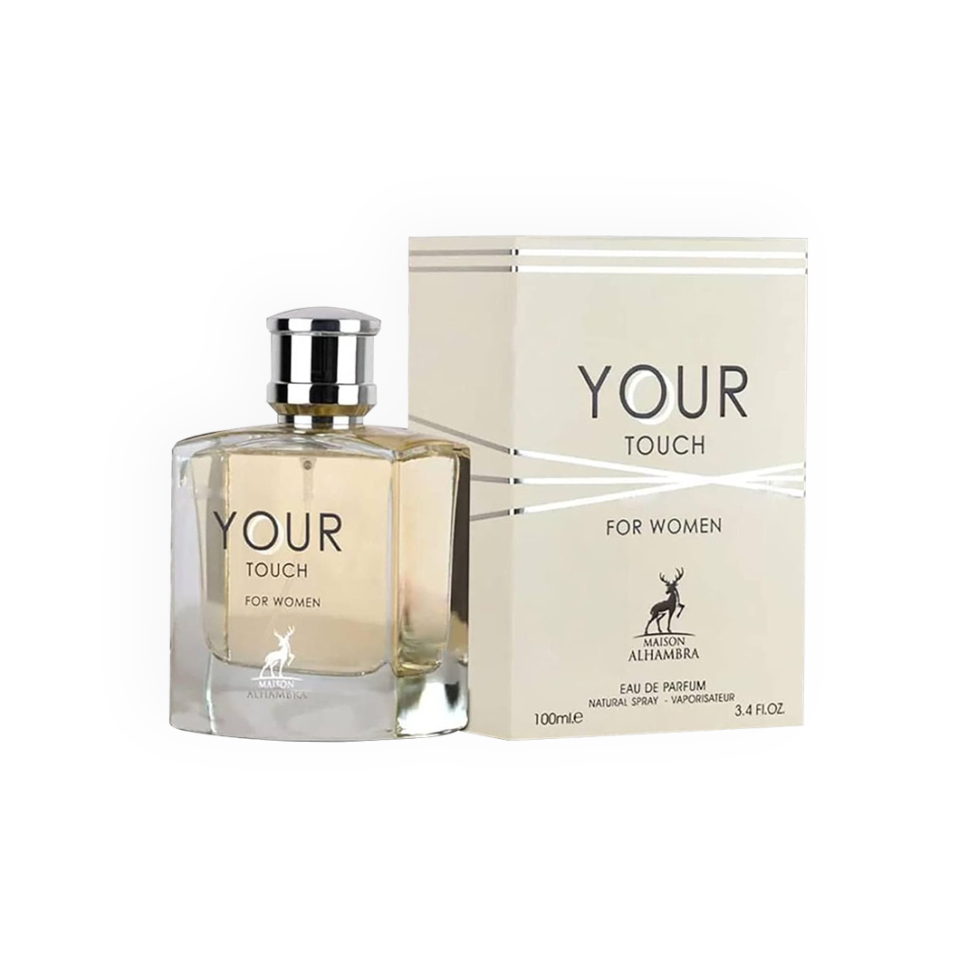 Packshot du parfum Your Touch For Women 100ml de la marque Maison Alhambra. Présente une bouteille élégante en verre transparent dévoilant un jus légèrement doré, associée à un bouchon argenté raffiné, et une boîte blanche ornée de lignes argentées modernes. Un visuel reflétant le luxe et la féminité.