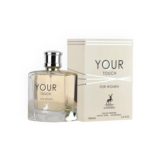Packshot du parfum Your Touch For Women 100ml de la marque Maison Alhambra. Présente une bouteille élégante en verre transparent dévoilant un jus légèrement doré, associée à un bouchon argenté raffiné, et une boîte blanche ornée de lignes argentées modernes. Un visuel reflétant le luxe et la féminité.