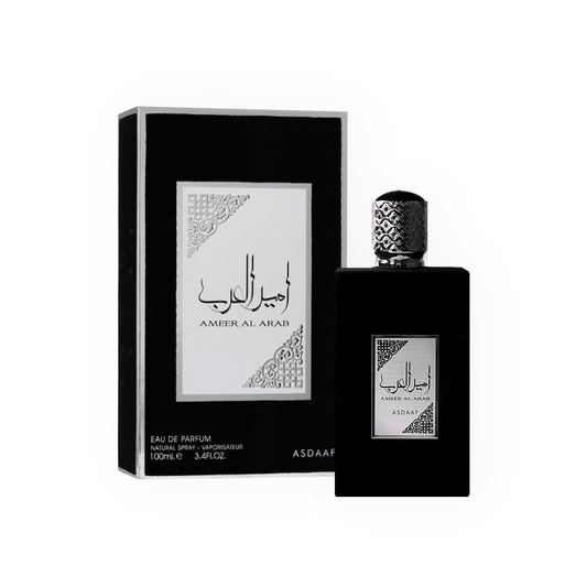 Eau de Parfum Ameer Al Arab Noir 100ml de Asdaaf, présentée dans un flacon noir mat sophistiqué avec un bouchon argenté gravé, accompagnée de son élégante boîte noire et blanche aux motifs orientaux.