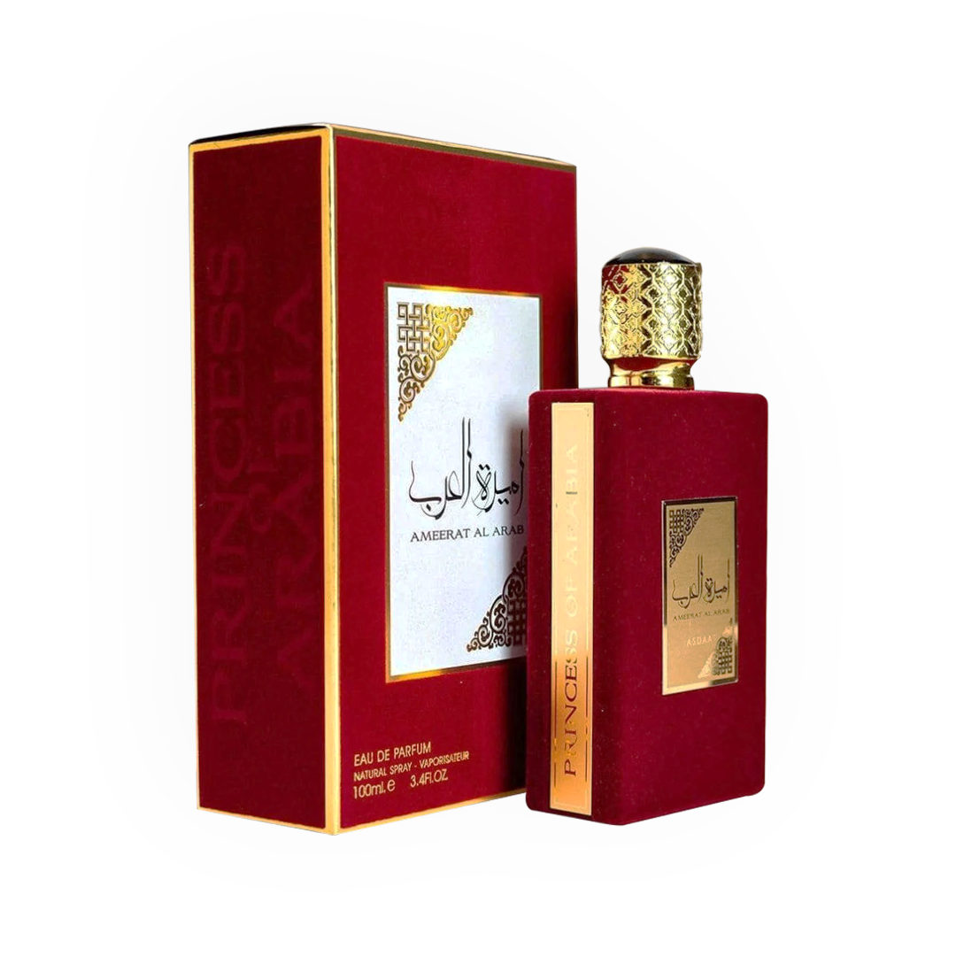 arfum Ameerat Al Arab Rouge 100ml - Asdaaf. Flacon élégant en velours rouge profond avec un bouchon doré finement travaillé, accompagné d'une boîte assortie aux détails dorés et arabesques. Eau de parfum orientale pour femme, senteur riche et sophistiquée. Idéal pour un style luxueux et une fragrance durable.