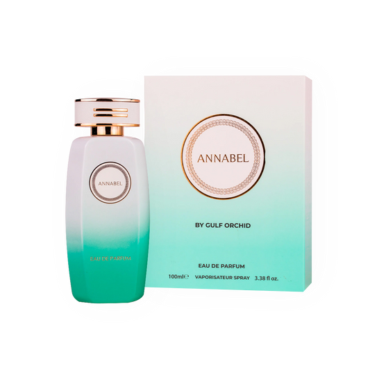 Parfum Annabel 100ml - Gulf Orchid. Flacon élégant blanc dégradé turquoise avec un bouchon doré raffiné, accompagné d'une boîte assortie au design épuré et moderne. Eau de parfum féminine, fraîche et légère, idéale pour une fragrance délicate aux notes florales et aquatiques. Parfait pour un style chic et quotidien.