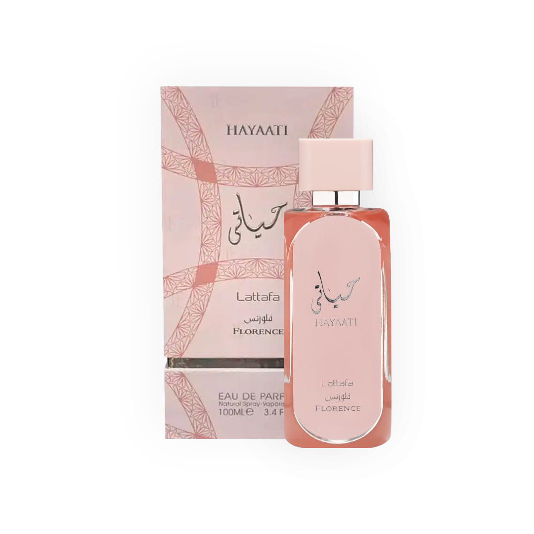 Parfum Hayaati Florence 100ml - Lattafa. Flacon élégant rose poudré avec un design épuré et bouchon assorti, accompagné d'une boîte rose ornée de motifs géométriques subtils. Eau de parfum pour femme, offrant des notes florales et fruitées délicates. Parfait pour une fragrance douce, féminine et sophistiquée.