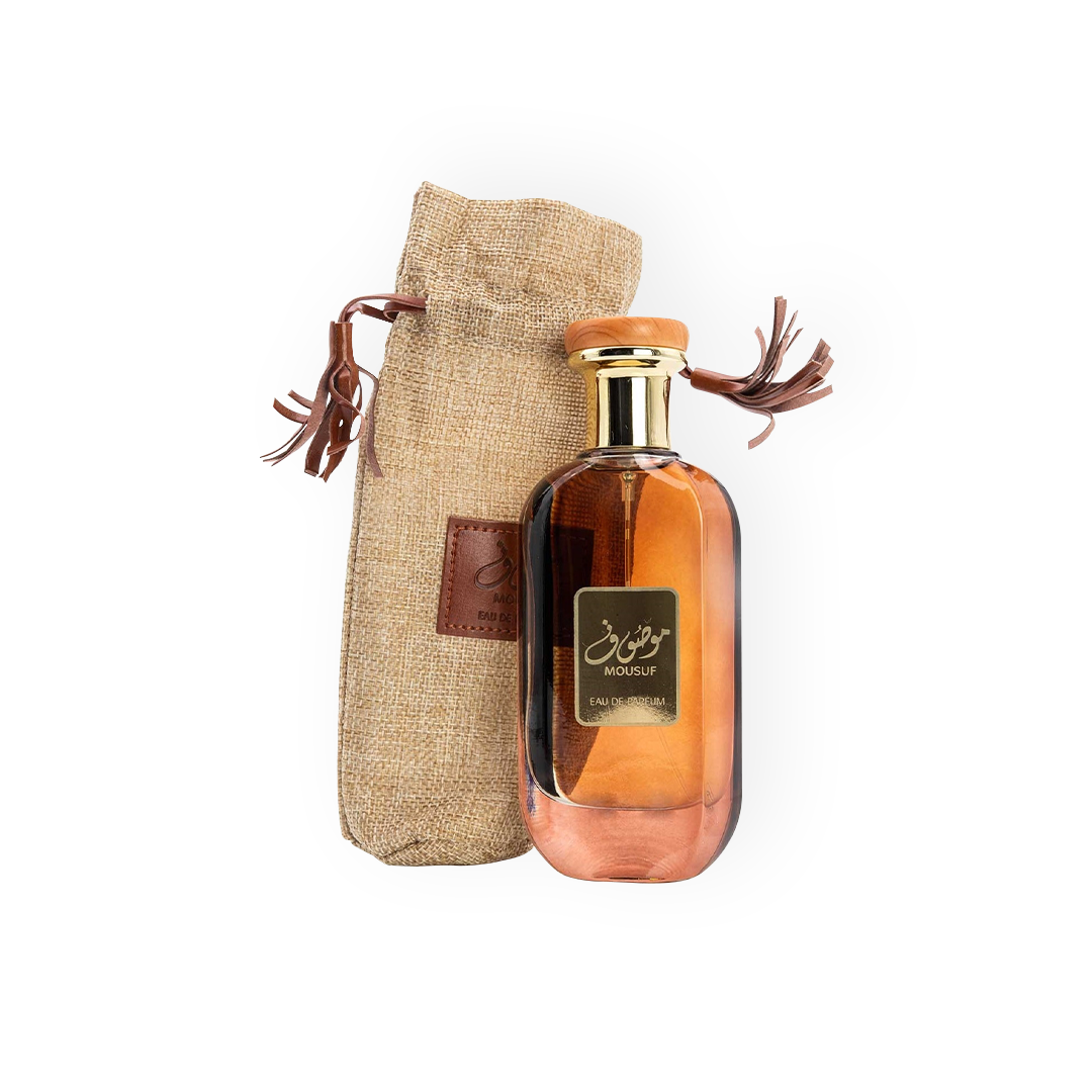 Flacon élégant de l'Eau de Parfum Mousuf 100ml d'Ard Al Zaafaran, avec un design raffiné doré et un sac en toile rustique, parfait pour un parfum oriental unique et captivant.