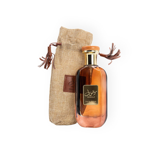 Flacon élégant de l'Eau de Parfum Mousuf 100ml d'Ard Al Zaafaran, avec un design raffiné doré et un sac en toile rustique, parfait pour un parfum oriental unique et captivant.