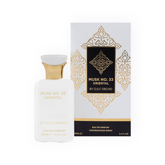 Parfum Musk No. 33 Oriental 100ml - Gulf Orchid. Flacon blanc épuré avec des détails dorés élégants, bouchon sculpté pour une finition luxueuse. Accompagné d'une boîte blanche ornée de motifs dorés et noirs raffinés. Eau de parfum orientale aux notes riches de musc, idéale pour une fragrance élégante, douce et intemporelle.