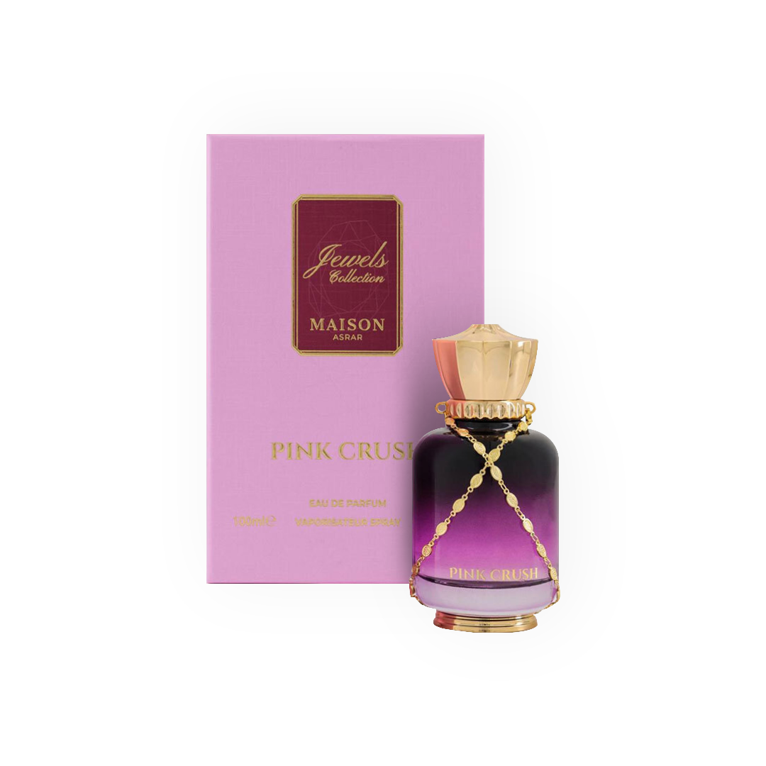 arfum Pink Crush 100ml - Jewels Collection, Maison Asrar. Flacon élégant aux dégradés rose et violet avec un bouchon doré orné d'une chaîne, accompagné d'une boîte rose assortie. Eau de parfum féminine aux notes florales et fruitées, parfaite pour une fragrance délicate, douce et envoûtante. Idéale pour une allure élégante et moderne.