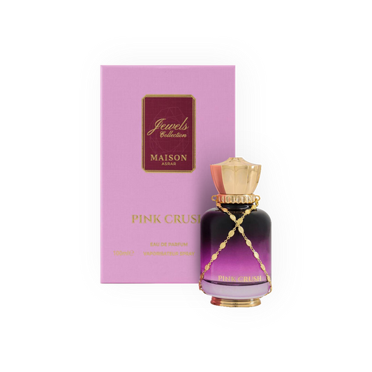 arfum Pink Crush 100ml - Jewels Collection, Maison Asrar. Flacon élégant aux dégradés rose et violet avec un bouchon doré orné d'une chaîne, accompagné d'une boîte rose assortie. Eau de parfum féminine aux notes florales et fruitées, parfaite pour une fragrance délicate, douce et envoûtante. Idéale pour une allure élégante et moderne.