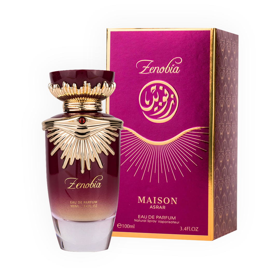 Parfum Zenobia 100ml - Gulf Orchid. Flacon luxueux dégradé bordeaux et doré avec un bouchon orné d’un design rayonnant, sublimé par une pierre rouge centrale. Eau de parfum pour femme aux notes riches, orientales et sophistiquées. Idéal pour une allure élégante et majestueuse.